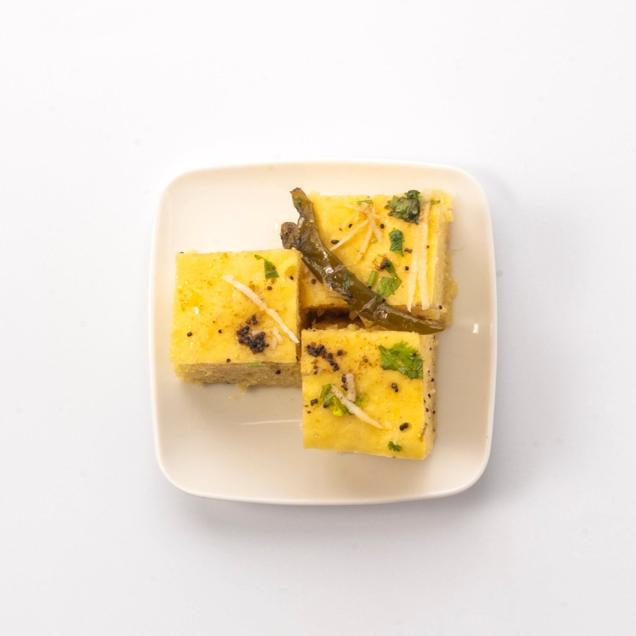 Dhokla Plain - www.neelkanthsweets.com